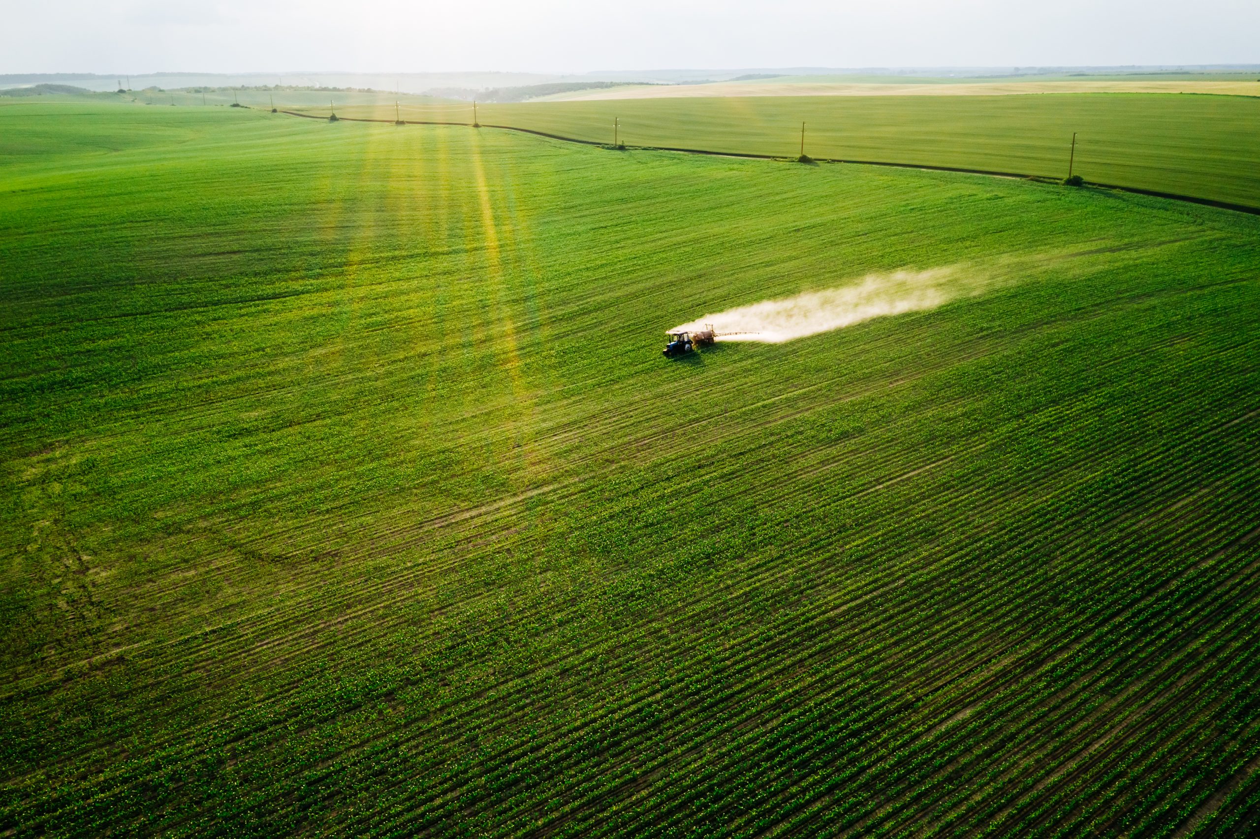 Scenic,Top,View,Of,A,Tractor,Spraying,Green,Fields.,Organic agriculture fertilizer ukraine
